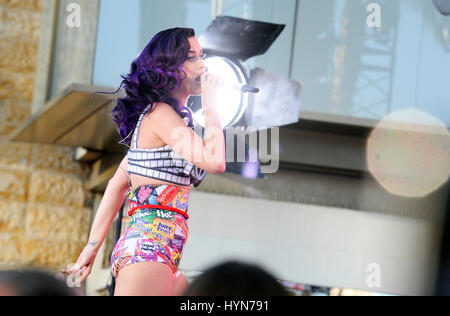 Katy Perry performs live on Hollywood Blvd before the premiere of her film 'Katy Perry: Part Of Me' at Grauman's Chinese Theatre in Hollywood, California on June 26, 2012. Stock Photo