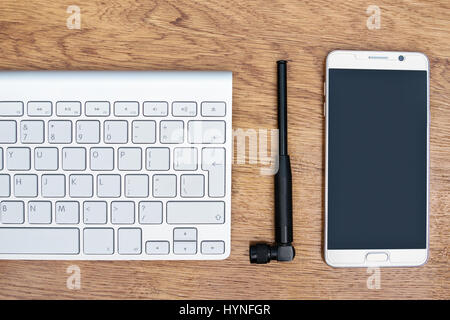 Telephone, antenna and keyboard on the table Stock Photo