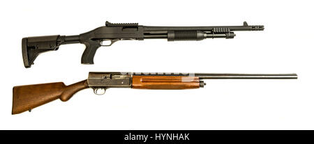 A vintage and modern tactical 12 gauge shotgun on an isolated background Stock Photo