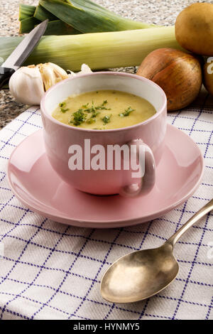 scottish leek and potato soup with parsley in a pink cup Stock Photo