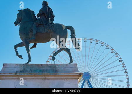 Equestrian statue of Louis XIV and ferris wheel, La Place Bellecour, Lyon, Auvergne-Rhone-Alpes, France, Europe. Stock Photo