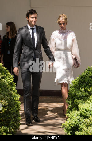 Washington, District Of Columbia, District of Columbia, USA. 5th Apr, 2017. Jared Kushner, senior White House adviser, left, and Ivanka Trump, assistant to U.S. President Donald Trump, walk out to the Rose Garden to hear President Trump and Jordan's King Abdullah II speak at a joint joint press conference in the Rose Garden of the White House White House in Washington, DC Credit: Ken Cedeno/ZUMA Wire/Alamy Live News Stock Photo