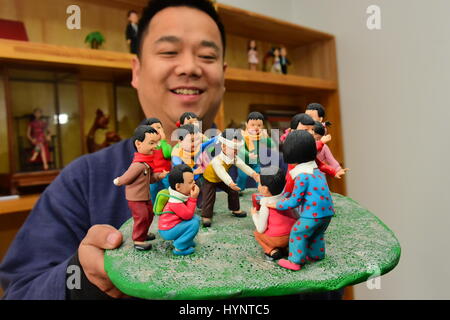 Zhengzhou, Zhengzhou, China. 5th Apr, 2017. Zhengzhou, CHINA-April 5 2017: (EDITORIAL USE ONLY. CHINA OUT) The folk artist Jia Guanghui shows his handmade clay figurines in Zhengzhou, central China's Henan Province, April 5th, 2017. Jia has been making clay figurines for twenty years, creating vivid figurines of celebrities including Jackie Chan, Barack and Michelle Obama. Jia also made figurines of characters in Chinese classic literature works including Dream of the Red Chamber and Heroes of the Marshes. Credit: SIPA Asia/ZUMA Wire/Alamy Live News Stock Photo