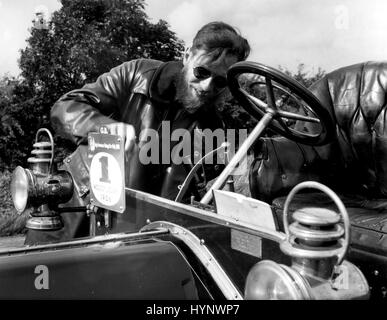 1972 - Bearded Vincent Rawlings, co-driver of the 1906 Wolseley - Siddeley which is now taking part in the first ever Anglo-American Vintage Car Rally, manned the pump when the engine pressure ran low on the run from Sulgrave into Oxford. The rally has taken teams of ten British and ten American vintage cars through some of Britain's loveliest countryside since the start of the rally from the Scottish capital of Edinburgh on September 4th. It finishes at the motor-racing circuit of Goodwood in Sussex, on September 11th, when the cars, several of them 1906 vintage, will go through arduous tests Stock Photo