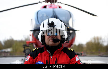 Rendsburg, Germany. 5th Apr, 2017. Pilot Dirk Kugel wears night vision goggles while standing in front of the medivac helicopter Christoph 42 in Rendsburg, Germany, 5 April 2017. The pilots of the German Air Rescue Service (DRF) are to be equipped with the new night vision goggles. Christoph 41 has been the main medivac helicopter for the state of Schleswig-Holstein since 1975. Over 47,000 missions have been flown since the rescue service's establishment. Photo: Carsten Rehder/dpa/Alamy Live News Stock Photo