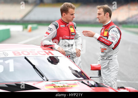 Hockenheim, Germany. 6th Apr, 2017. DTM race drivers Nico Mueller (l) from Switzerland and Jamie Green from the UK of Audi speak during the media day of the Deutsche Tourenwagen Masters (German Touring Car Masters, DTM) race series at hockenheimring in Hockenheim, Germany, 6 April 2017. Photo: Uwe Anspach/dpa/Alamy Live News