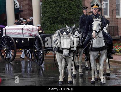 Arlington, Virginia, USA. 6th Apr, 2017. The horse drawn hearse processes with the remains of John Glenn during the funeral services at Arlington National Cemetery April 6, 2017 in Arlington, Virginia. Glenn, the first American astronaut to orbit the Earth and later a United States senator, died at the age of 95 on December 8, 2016. Credit: Planetpix/Alamy Live News Stock Photo