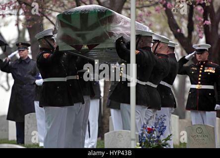 Arlington, Virginia, USA. 6th Apr, 2017. Marine Corps honor guard carry the casket during the gravesite funeral services for John Glenn at Arlington National Cemetery April 6, 2017 in Arlington, Virginia. Glenn, the first American astronaut to orbit the Earth and later a United States senator, died at the age of 95 on December 8, 2016. Credit: Planetpix/Alamy Live News Stock Photo