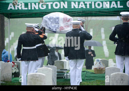 Arlington, Virginia, USA. 6th Apr, 2017. Marine Corps honor guard carry the casket during the gravesite funeral services for John Glenn at Arlington National Cemetery April 6, 2017 in Arlington, Virginia. Glenn, the first American astronaut to orbit the Earth and later a United States senator, died at the age of 95 on December 8, 2016. Credit: Planetpix/Alamy Live News Stock Photo