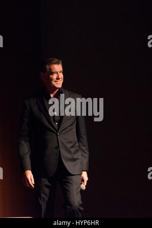 Actor Pierce Brosnan walks on stage for a discussion of the new AMC television series The Son based on the novel by Philipp Meyer at the LBJ Presidential Library March 13, 2017 in Austin, Texas. Stock Photo