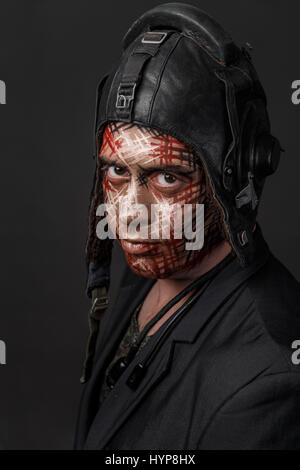 Portrait of Brutal Man with Creative Military Style Camouflage. Face Paint.  Close up on black background by Sergii Zarev. Photo stock - StudioNow