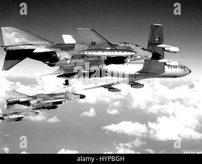 A flight of U.S. Air Force F-4C Phantom fighter bombers refuel from a KC-135 tanker aircraft prior to making a strike against communist targets in North Vietnam.  The Phantoms are fully loaded with 750 pound general purpose bombs and rockets, circa 1969.