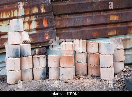 Used coal briquette on the street Stock Photo