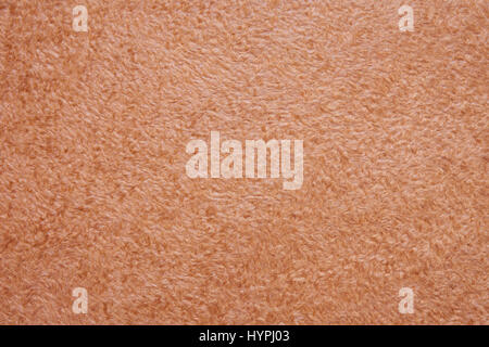 Beige fluffy flooring as a seamless background Stock Photo