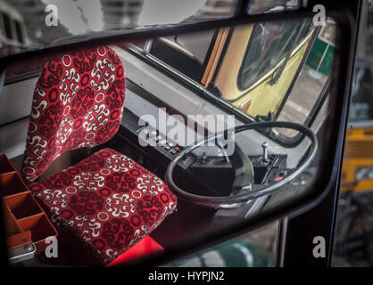 Drivers seat and steering wheel  looking through mirror Stock Photo