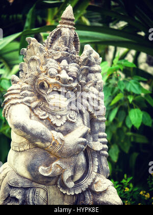 Ancient Balinese statue at the temple in Bali Indonesia Stock Photo