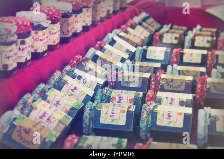 Jars of home made jar on a stall in market Stock Photo