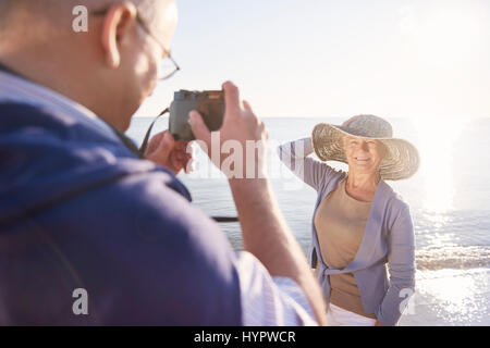 Senior man taking photos of his wife Stock Photo