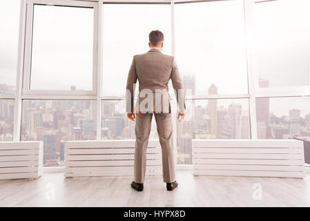 Confident businessman standing in his office Stock Photo