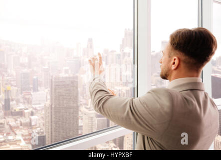 Successful businessman using modern technologies in office Stock Photo