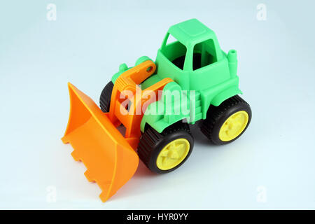 Bulldozer toy. Small Dredge toy model. Stock Photo