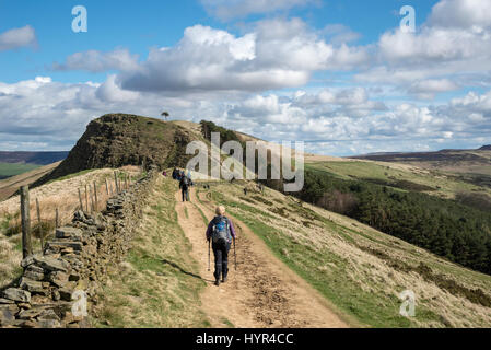 Walkers on the great ridge from Mam Tor to Lose Hill on a sunny spring day in the Peak District national park, England. Stock Photo