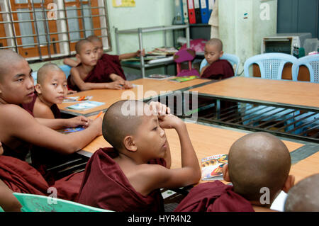 Myanmar (Burma). Yangon. Young Buddhist novice monks, many of them from distant states, at boarding school in the city. Stock Photo