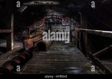 HAUNTING pictures show the rusty remains of the Hardy and Hanson brewery, one of the oldest independent breweries in the UK. Abandoned since 2006, the eerie shots show the dilapidated machines that would have produced gallons of beer on a daily basis, including favourites such as Hardy and Hanson’s Bitter and Olde Trip. Other images show the graffiti-clad walls of the factory, the ruins of an office and a peek through the window overlooking the overgrown yard. Hardy and Hanson’s heritage can be dated back to 1832.  The commercial brewery was opened by Samuel Robinson using water from the Alley Stock Photo