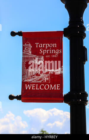 Tarpon Springs Welcome banner hanging from a downtown lamp post in this Florida City Stock Photo