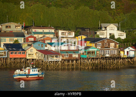 Palafitos. Traditional wooden houses built on stilts along the waters edge in Castro, capital of the Island of Chiloé. Stock Photo