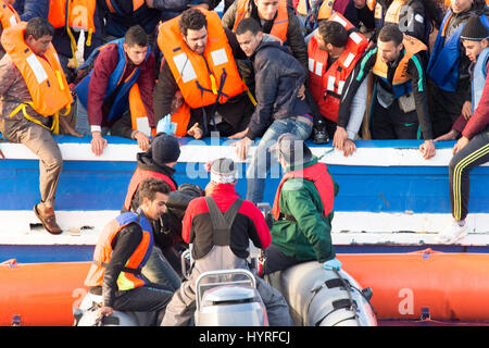 A 17 meter long wooden boat, found in the morning around 15 nautical miles away from the Libyan coast. 399 people, who are on board are trying to cros Stock Photo