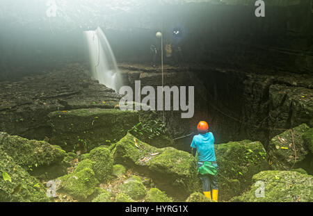 Speleologists At Mayei Cave The Cave Where The Wind Is Born (Cueva Donde Nace El Viento) In Ecuadorian Amazonia Waterfall Entrance Stock Photo