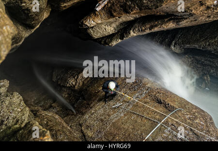 Speleologist Interior Of Mayei Cave Waterfall Entrance Shaft In Ecuadorian Amazonia Stock Photo