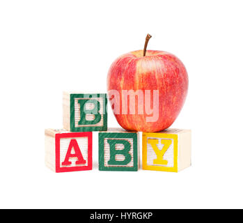 Wooden blocks and apple with baby isolated on white background Stock Photo