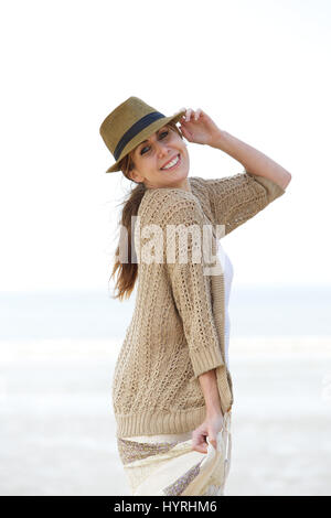Portrait of a beautiful middle aged woman smiling at the beach Stock Photo