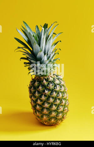 Pineapple On Yellow Background Stock Photo