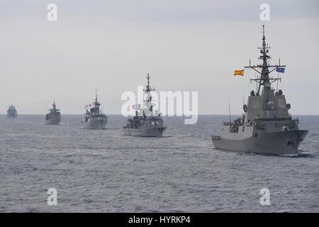 NATO warships from Spain, France, Canada and the United States steam in formation during Exercise Dynamic Manta March 13, 2017 in the Mediterranean Sea. Ship include from right to left: FS Montcalm, HCMS St Johns, HS Adrias, FS Marne. Stock Photo