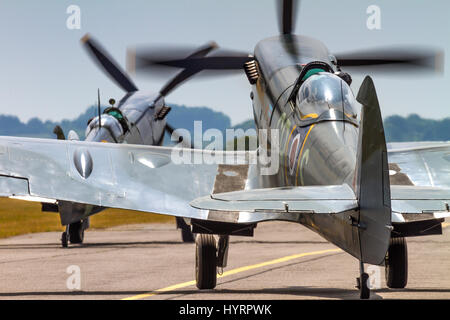A pair of Supermarine Spitfires taxying on July 13th 2013 at Duxford, Cambridgeshire, UK Stock Photo