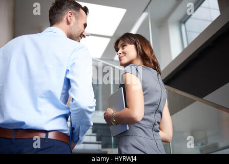Rear view of couple on stairs Stock Photo