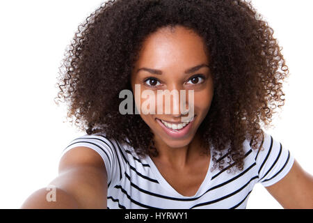 Self portrait of a young woman making a selfie against isolated white background Stock Photo