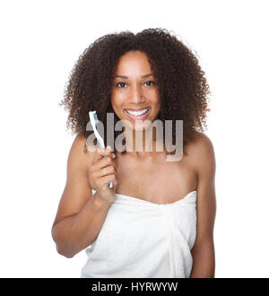 Close up portrait of an smiling young woman holding toothbrush Stock Photo