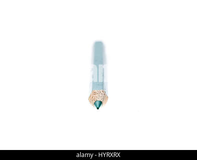 Tip of sharpened old green colour pencil isolated on white background. Used old color pencil is sharpened and reused. Creativity and conservation conc Stock Photo