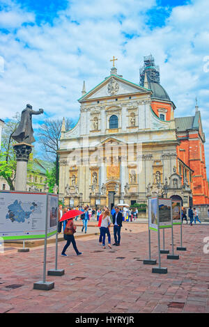 Krakow, Poland - May 1, 2014: People at Church of Saint Peter and Paul on Maria Magdalena square in old town of Krakow, Poland Stock Photo