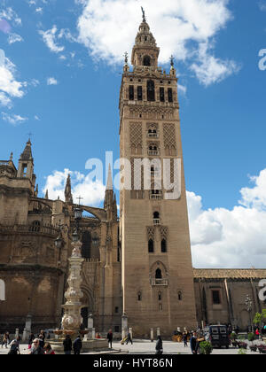 View looking up at the Giralda bell tower of Seville Cathedral in Spain Stock Photo