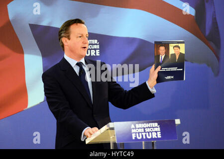 Prime Minister David Cameron holds up a copy of the Scottish Conservative manifesto at its launch in Glasgow Stock Photo