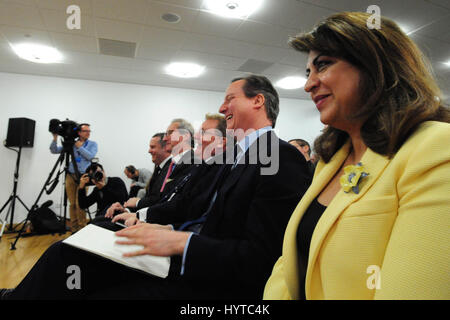 Prime Minister David Cameron laughs during Scottish Conservative leader Ruth Davidson's speech at the launch of the Scottish Conservative manifesto Stock Photo