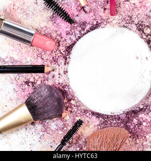 Makeup brushes, lipstick etc forming frame for copyspace Stock Photo