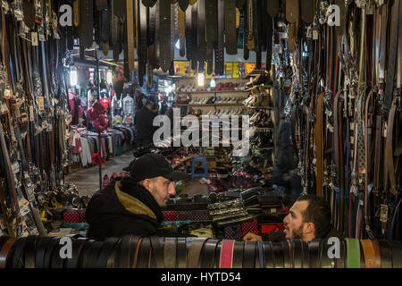 GJILAN - GNJILANE, KOSOVO - JANUARY 02, 2016: Salesmen in the local bazaar selling belts Stock Photo