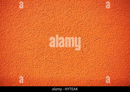 Orange rough plaster wall, rugged texture or background. Stock Photo