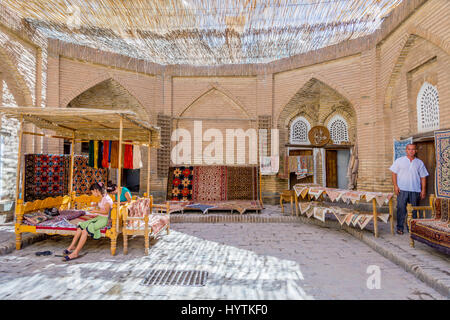 KHIVA, UZBEKISTAN - SEPTEMBER 7: Carpet shop and workshop with traditional uzbek carpets and embroideries. September 2016 Stock Photo